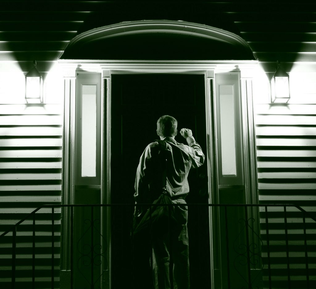 Man knocking on neighbors door