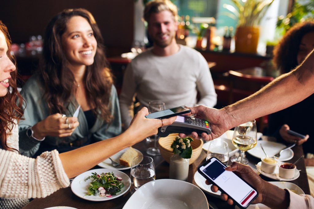 A group of friends splitting bill