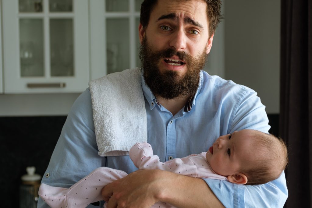 Father holding baby - stock image