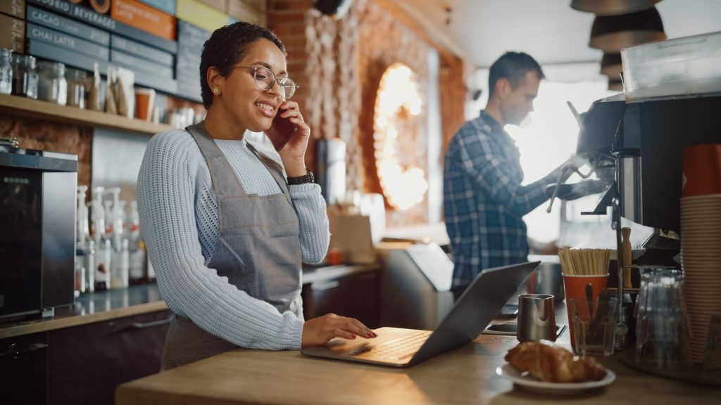Woman on phone at restaurant