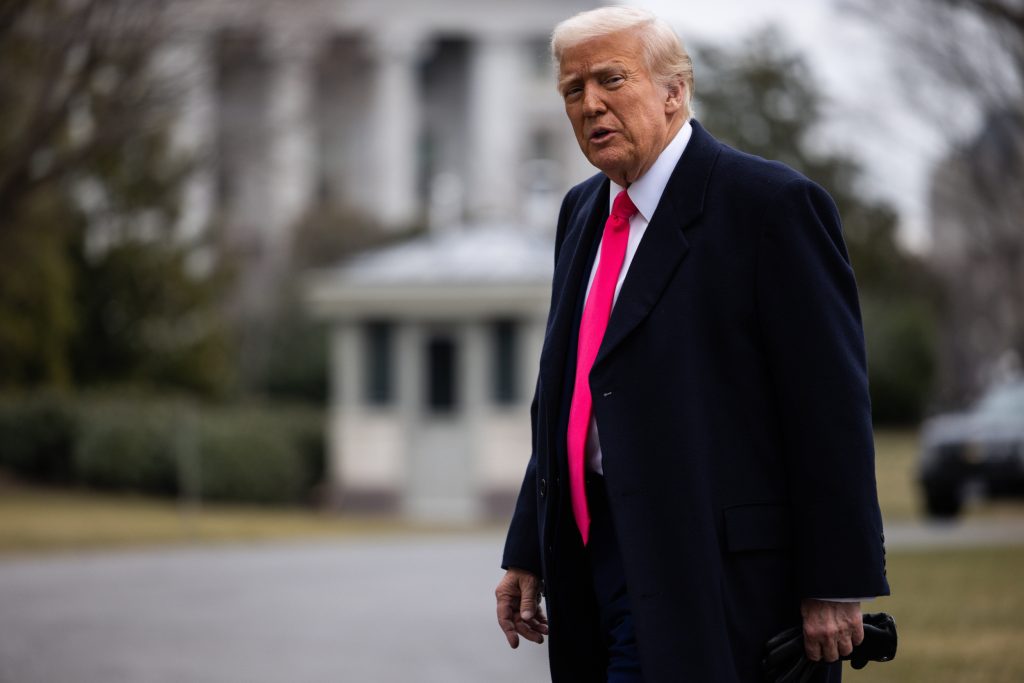 President Donald Trump walks to the Residence