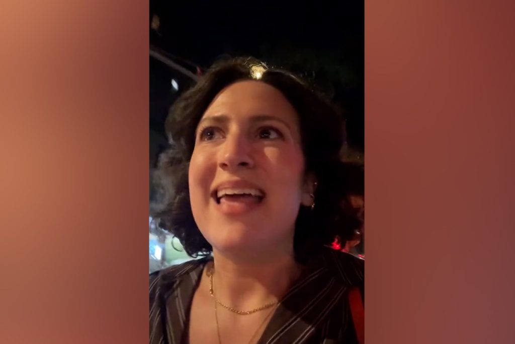 Emily Wilson walking on Prince Street, Manhattan.