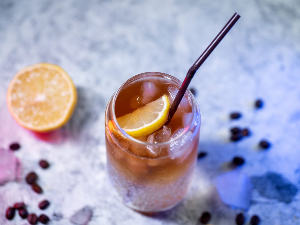 Stock image of espresso and lemon.